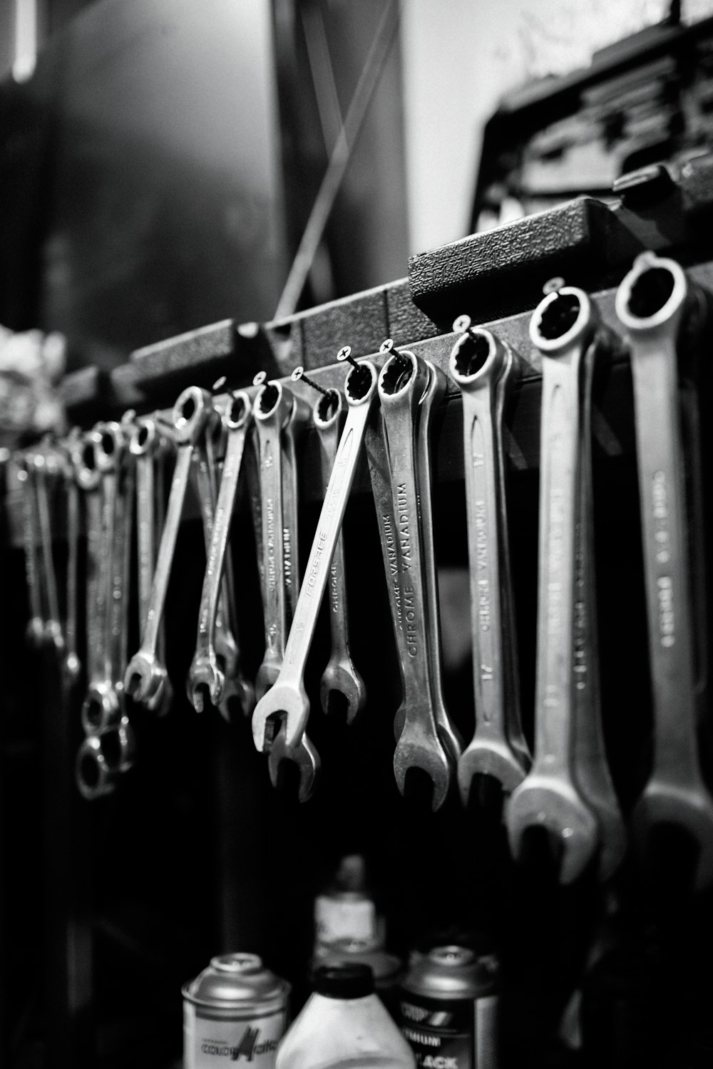 Row of wrenches hanging in a workshop